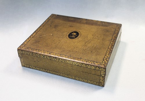Lot 17 - A Chinese export black and gold lacquer games box, 19th century