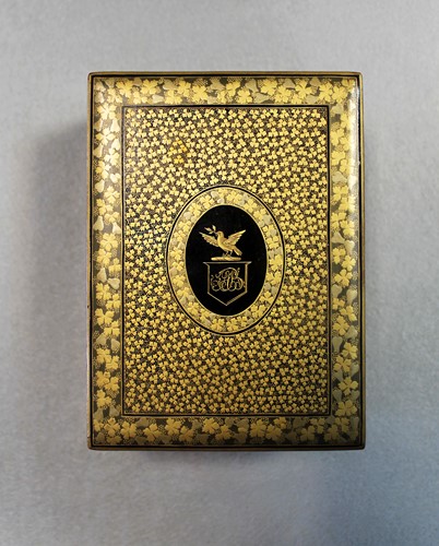 Lot 17 - A Chinese export black and gold lacquer games box, 19th century