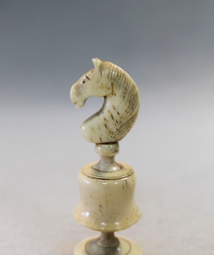 Lot 79 - A turned bone and boxwood 'Lyon' variant chess set, 19th century