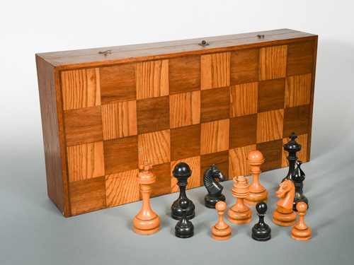 Lot 80 - A large scale chess set in folding box, 20th century