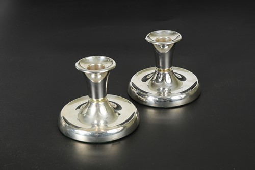 Lot 127 - David Andersen, a pair of Norwegian metalwares dwarf candlesticks