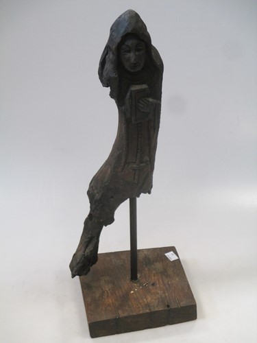 Lot 74 - A root carving of a saint, mounted on stand