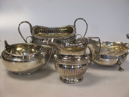 Lot 221 - Two silver sugar bowls, a silver cream jug and...