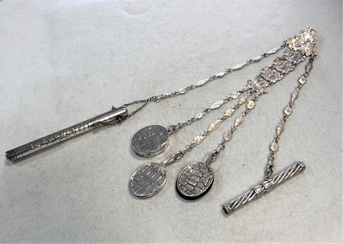 Lot 353 - An Edward VII silver chatelaine with four attachments and one addition