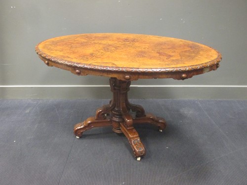 Lot 418 - A Victorian walnut tilt-top loo table 70 x 130...