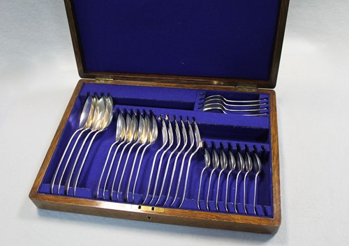 Lot 602 - A canteen containing a 27 piece dessert set of George V silver flatware