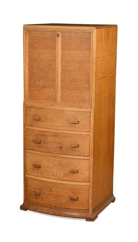 Lot 194 - A Heal's style golden oak bow fronted drinks cabinet