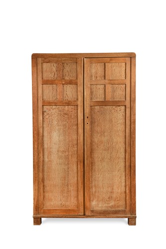 Lot 188 - A Heal's limed oak Cotswold style fitted wardrobe circa1925