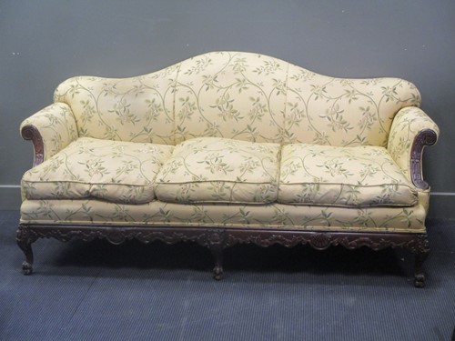 Lot 399 - A carved frame camel back sofa, early 20th...