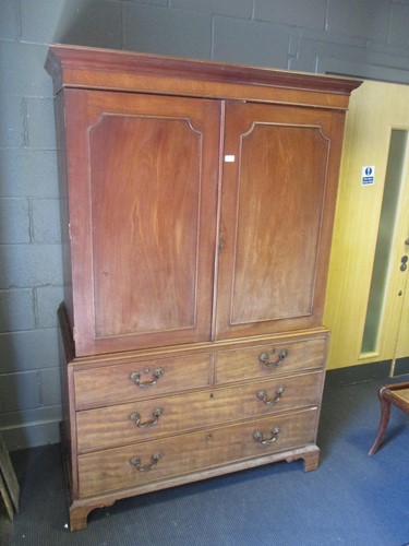 Lot 509 - A 19th century mahogany linen press on bracket...