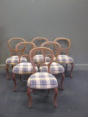 Lot 488 - A set of six Victorian walnut balloon back...