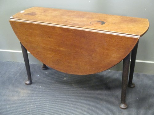 Lot 504 - A George III mahogany drop leaf table on pad...