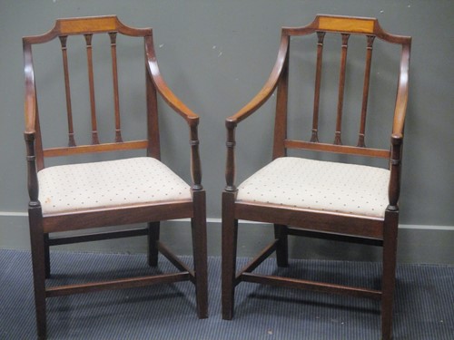 Lot 437 - A pair of Sheraton style mahogany arm chairs...