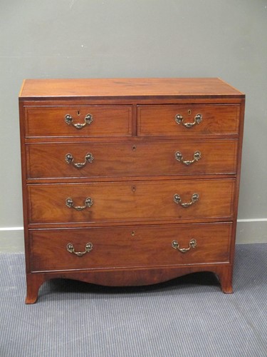 Lot 407 - A George III flame mahogany chest of drawers,...