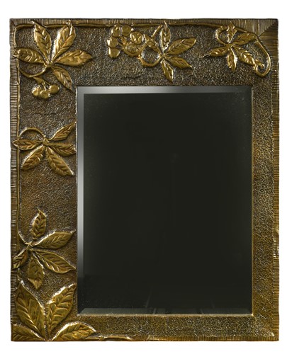 Lot 143 - An Arts & Crafts style brass framed mirror