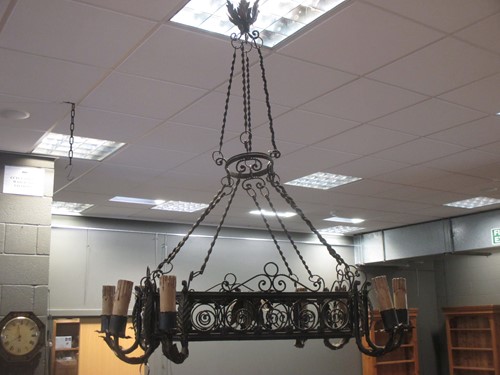 Lot 415 - A wrought iron hanging chandelier