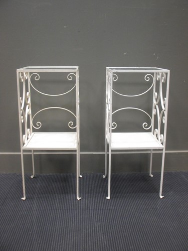 Lot 497 - A pair of wrought iron white painted tables...