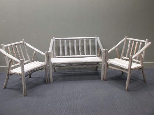 Lot 532 - A set of rustic garden furniture, to include a...