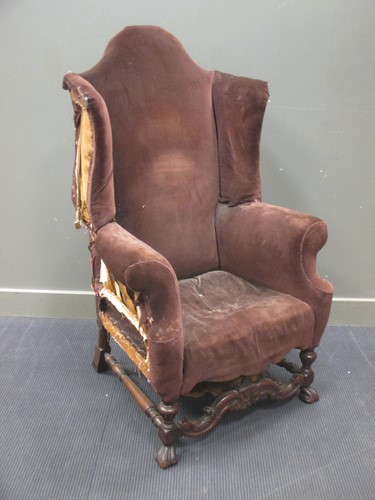 Lot 423 - A large Queen Anne style walnut framed wing...