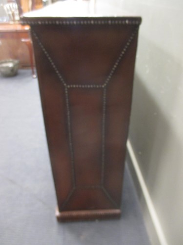 Lot 514 - A leather studded bookcase with adjustable...