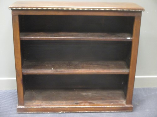 Lot 514 - A leather studded bookcase with adjustable...