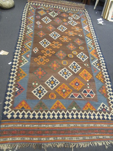 Lot 546 - A Causcasian kelim carpet with geometric design
