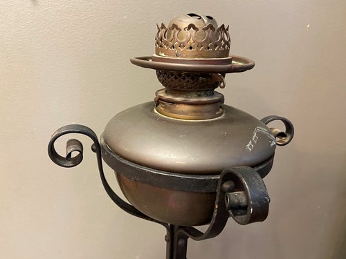 Lot 142 - An Arts & Crafts copper and wrought iron standard lamp in the manner of W/.A.S Benson