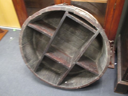 Lot 402 - A hanging 'barrel' shelf unit, 75cm diameter