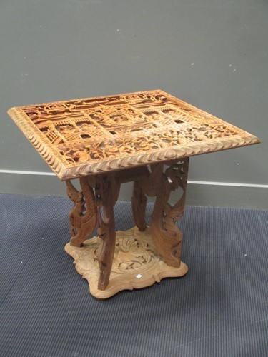 Lot 487 - An Eastern carved table, 678 x 67 x 77cm
