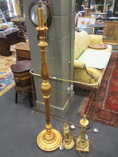 Lot 526 - A gold painted standing lamp, two similar...