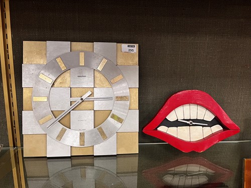Lot 41 - A painted wood wall clock as the Joker's Smile from Batman