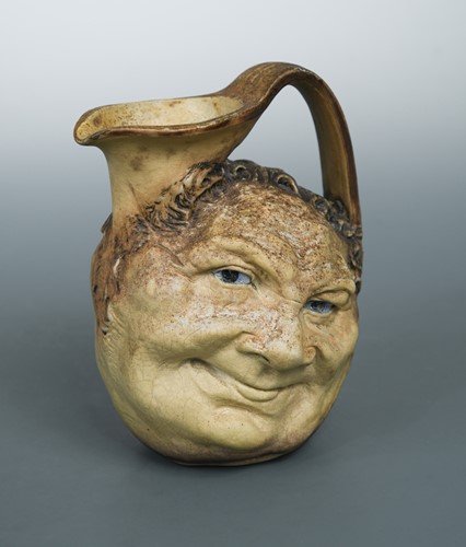 Lot 31 - Robert Wallace Martin for Martin Brothers, a stoneware face jug, 1900