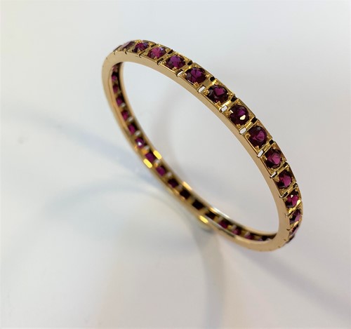 Lot 111 - A continuous stone set bangle