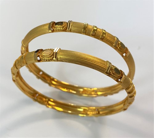 Lot 71 - A pair of Indian kada bangles