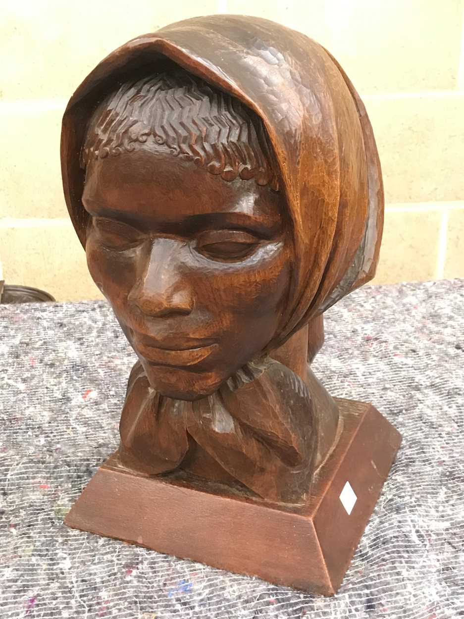 Lot 177 - A carved female head bust wearing a scarf,...