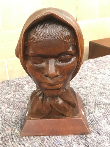 Lot 177 - A carved female head bust wearing a scarf,...