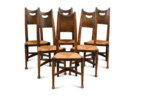 Lot 180 - Attributed to George Walton for William Birch, High Wycombe, a set of six stained ash dining chairs, circa 1900