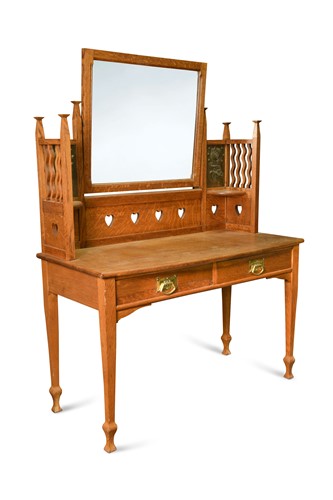 Lot 177 - An Arts & Crafts oak bow front dressing table