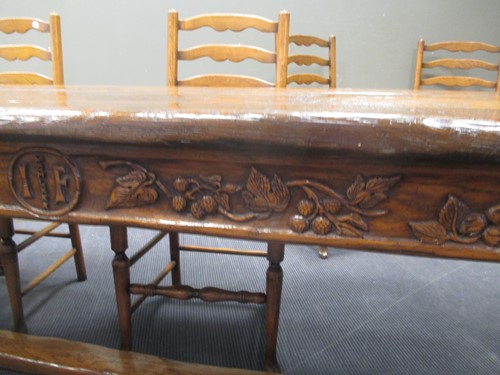 Lot 355 - A reproduction oak refectory table with carved...