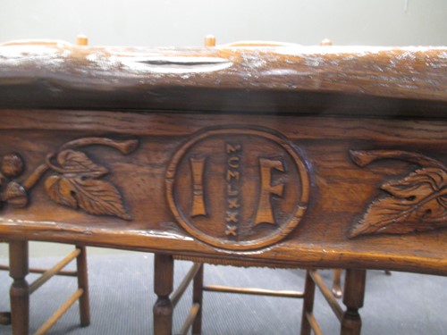 Lot 355 - A reproduction oak refectory table with carved...