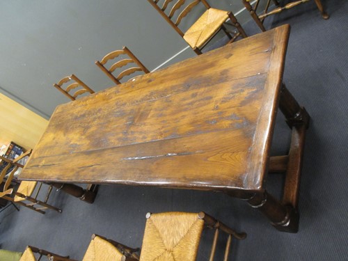 Lot 355 - A reproduction oak refectory table with carved...