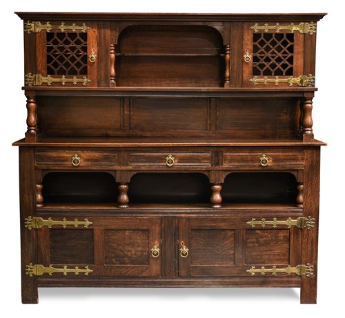 Lot 174 - An early 20th century Arts & Crafts style oak side cabinet