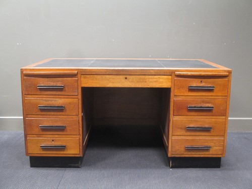 Lot 196 - An Art Deco oak twin pedestal desk