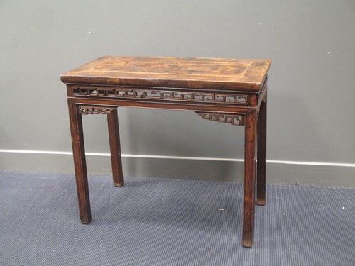 Lot 393 - A 19th century Chinese elm altar table, with...