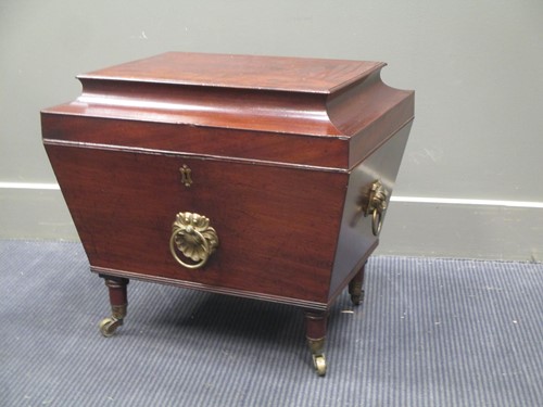 Lot 394 - A George III and later mahogany cellarette...