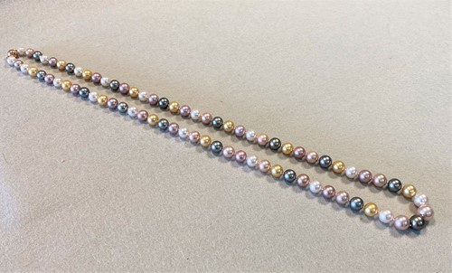 Lot 188 - A row of multicoloured cultured pearls of natural colour