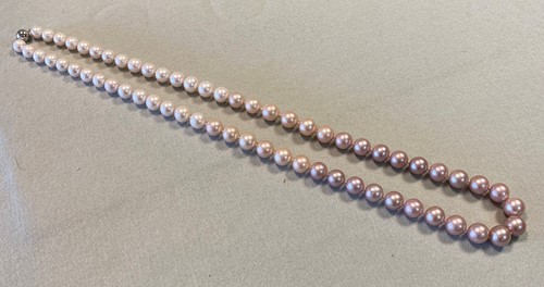 Lot 170 - A row of Edison Freshwater cultured pearls of graduating colour and exceptional size