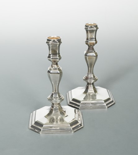 Lot 611 - A pair of 20th Century cast silver candlesticks