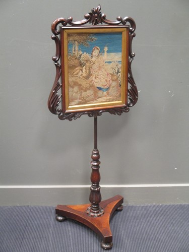 Lot 388 - A Williiam IV rosewood polescreen, on a...