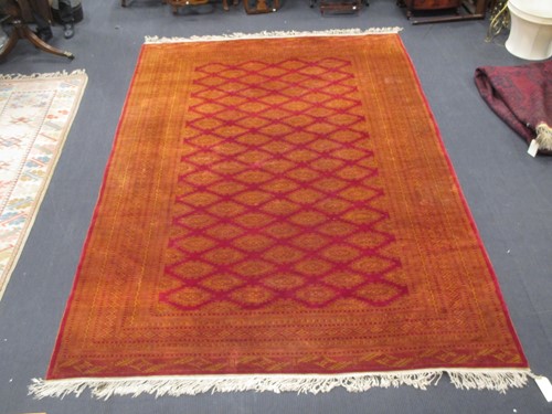 Lot 419 - A machine made Afgan style rug 360 x 242cm